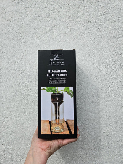 Self-watering bottle planter